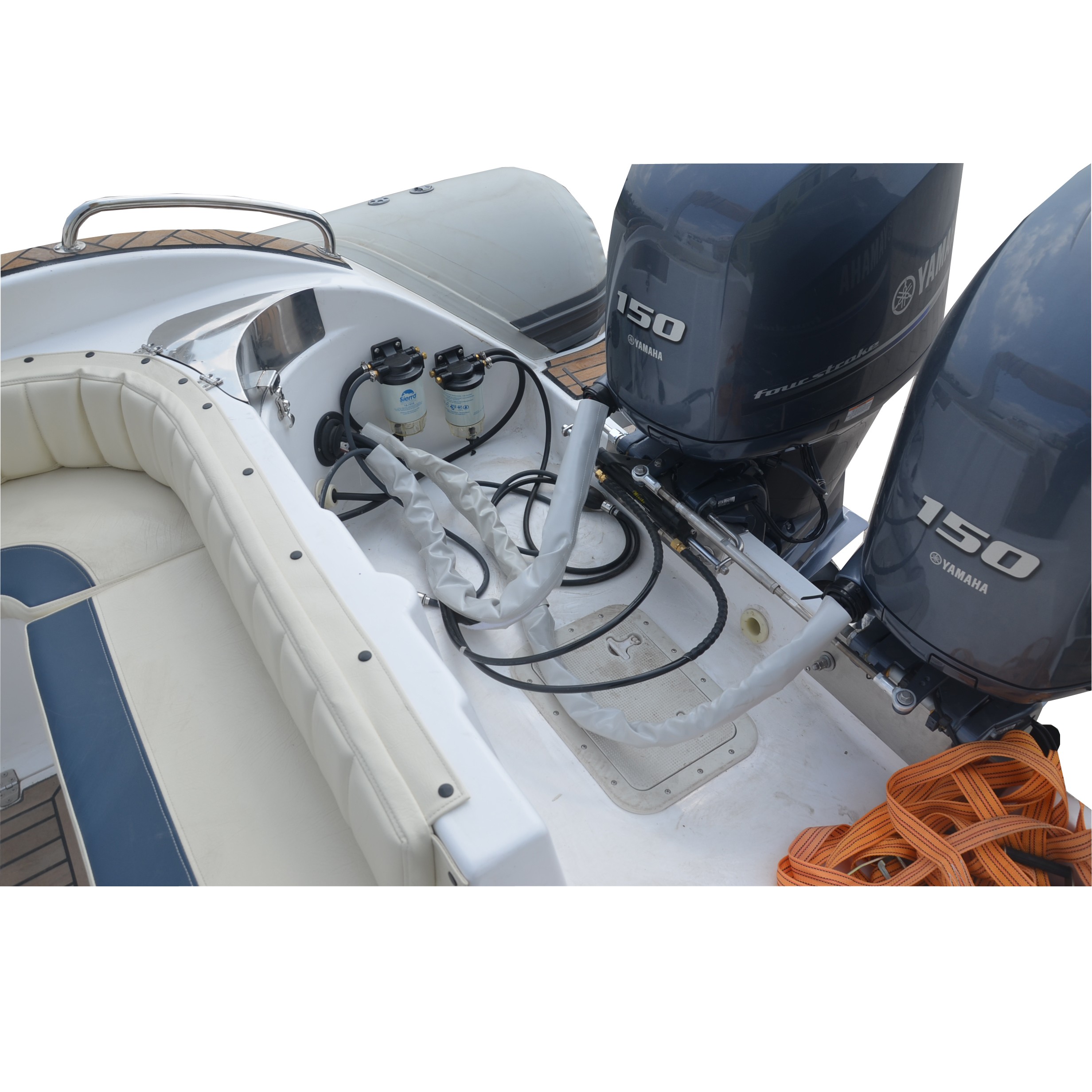 Rigid hull inflatable boat with outboard motor in the shore beaten by the  waves. Used to fish at sea Stock Photo by wirestock